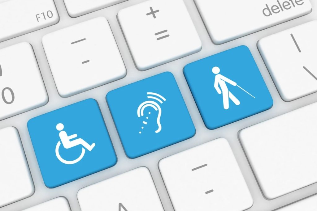 A keyboard adorned with blue icons of individuals with disabilities, highlighting the importance of accessibility in technology.